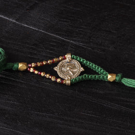 Handcrafted tribal dokra brass thread rakhi 35