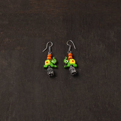 Saanvi german silver jhumki earrings with wooden elephant