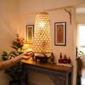 Greenkraft Velune Handcrafted Bamboo Lamp for Home Decor, lit in a home in the evening, AI visual of the light, iTokri