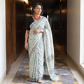 White hand block print merino wool Sanganeri saree, draped and worn by a woman, AI visual of the saree, iTokri