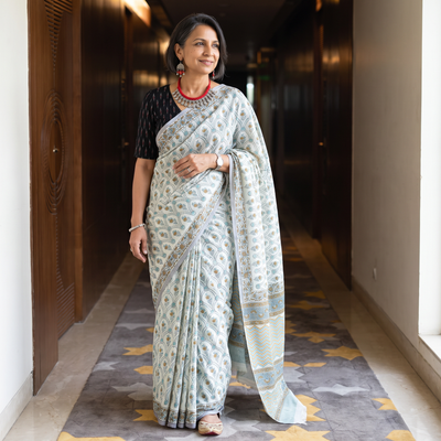White hand block print merino wool Sanganeri saree, draped and worn by a woman, AI visual of the saree, iTokri