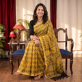 Yellow Ajrakh hand block print natural dyed Kota Doria cotton saree, draped and worn by a woman, AI visual of the saree, iTokri