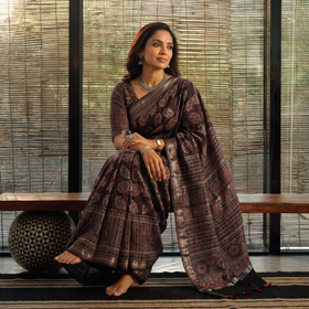 Brown Hand Block Print Natural Dyed Maheshwari Silk Ajrakh Saree, draped and worn by a woman, AI visual of the saree, iTokri
