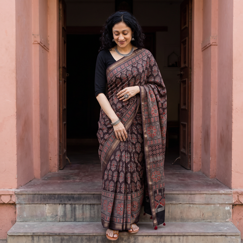Brown Hand Block Print Natural Dyed Maheshwari Silk Ajrakh Saree, draped and worn by a woman, AI visual of the saree, iTokri