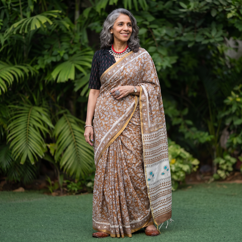 Brown hand block printed Chanderi silk Sanganeri saree, draped and worn by a woman, AI visual of the saree, iTokri