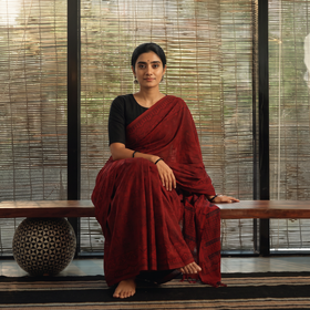 Red Hand Block Printed Cotton Bagh Saree, draped and worn by a woman, AI visual of the saree, iTokri