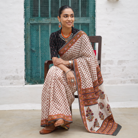 White hand block printed pure mul cotton Sanganeri saree, draped and worn by a woman, AI visual of the saree, iTokri