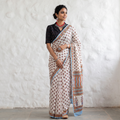 White hand block printed pure mul cotton Sanganeri saree, draped and worn by a woman, by artisan Santosh Dhanopia, AI visual of the saree, iTokri