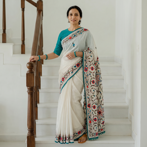 White Hand Embroidered Chapa Work Silk Cotton Saree, draped and worn by a woman, AI visual of the saree, iTokri