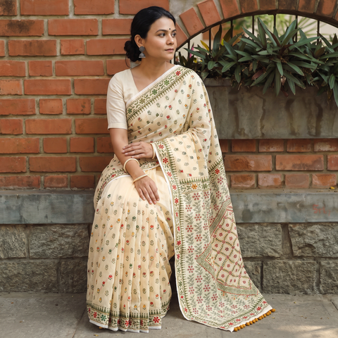 Beige Hand Embroidered Chapa Work Silk Cotton Saree, draped and worn by a woman, AI visual of the saree, iTokri
