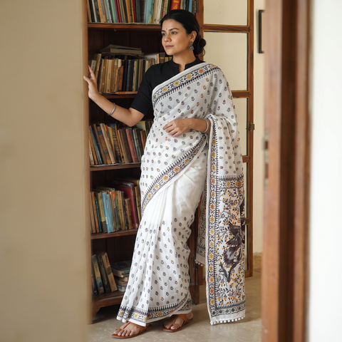 White Hand Embroidered Chapa Work Silk Cotton Saree, draped and worn by a woman, AI visual of the saree, iTokri