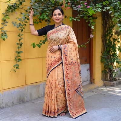 Peach Hand Embroidered Chapa Work Silk Cotton Saree, draped and worn by a woman, AI visual of the saree, iTokri