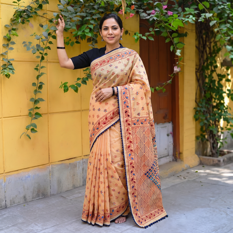 Peach Hand Embroidered Chapa Work Silk Cotton Saree, draped and worn by a woman, AI visual of the saree, iTokri