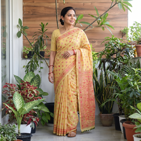 Yellow Hand Embroidered Chapa Work Silk Cotton Saree, draped and worn by a woman, AI visual of the saree, iTokri