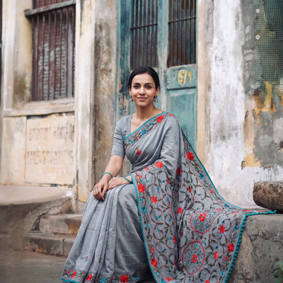 Grey Hand Embroidered Chapa Work Silk Cotton Saree, draped and worn by a woman, AI visual of the saree, iTokri