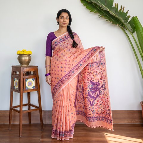 Peach Hand Embroidered Chapa Work Silk Cotton Saree, draped and worn by a woman, AI visual of the saree, iTokri