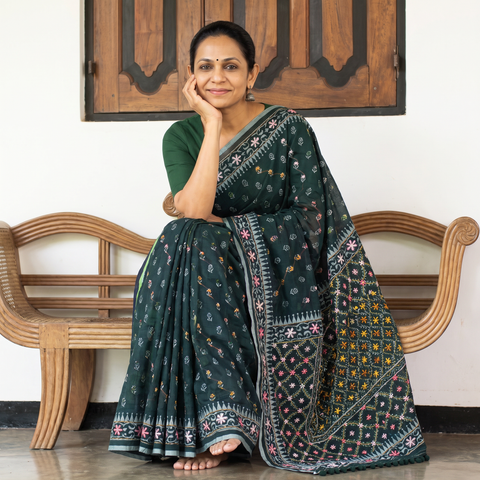 Green Hand Embroidered Chapa Work Silk Cotton Saree, draped and worn by a woman, AI visual of the saree, iTokri