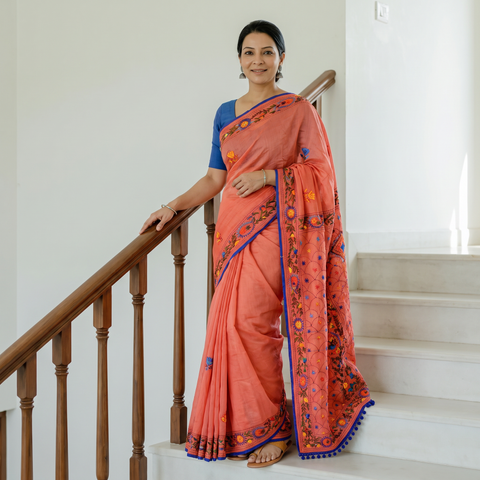Orange Hand Embroidered Chapa Work Silk Cotton Saree, draped and worn by a woman, AI visual of the saree, iTokri