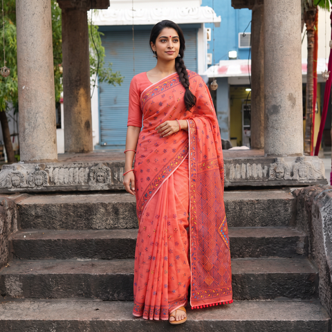 Peach Hand Embroidered Chapa Work Silk Cotton Saree, draped and worn by a woman, AI visual of the saree, iTokri