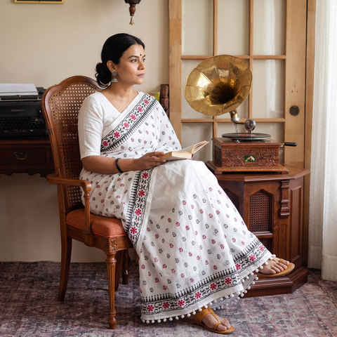 White Hand Embroidered Chapa Work Silk Cotton Saree, draped and worn by a woman, AI visual of the saree, iTokri