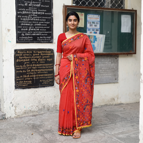 Red Hand Embroidered Chapa Work Silk Cotton Saree, draped and worn by a woman, AI visual of the saree, iTokri