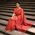 Red Hand Embroidered Chapa Work Silk Cotton Saree, draped and worn by a woman, AI visual of the saree, iTokri