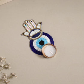Hand embroidered hamsa evil eye beaded tealight candle