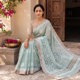 Blue Hand Embroidered Kota Doria Cotton Lucknowi Chikankari Saree with Border, draped and worn by a woman, AI visual of the saree, iTokri