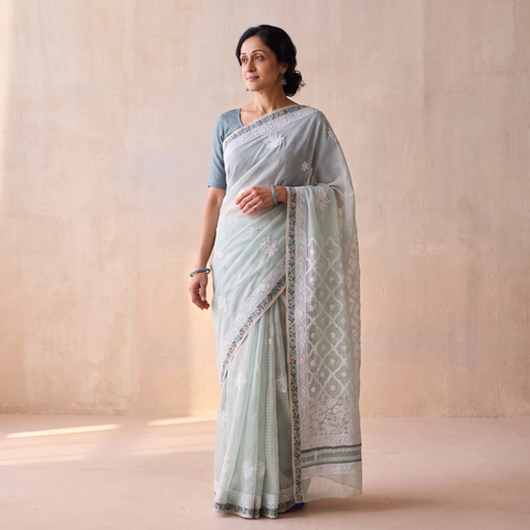 Green Hand Embroidered Kota Doria Cotton Lucknowi Chikankari Saree with Border, draped and worn by a woman, AI visual of the saree, iTokri