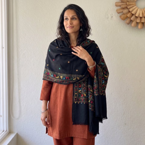 Black Hand Embroidered Phulkari Wool Shawl, worn by a model, AI visual of the shawl, iTokri