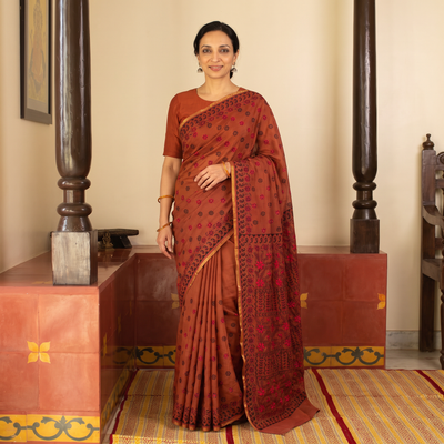 Red Hand Embroidered Silk Cotton Chapa Work Saree, draped and worn by a woman, AI visual of the saree, iTokri