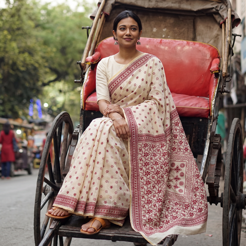 White Hand Embroidered Silk Cotton Chapa Work Saree, draped and worn by a woman, AI visual of the saree, iTokri