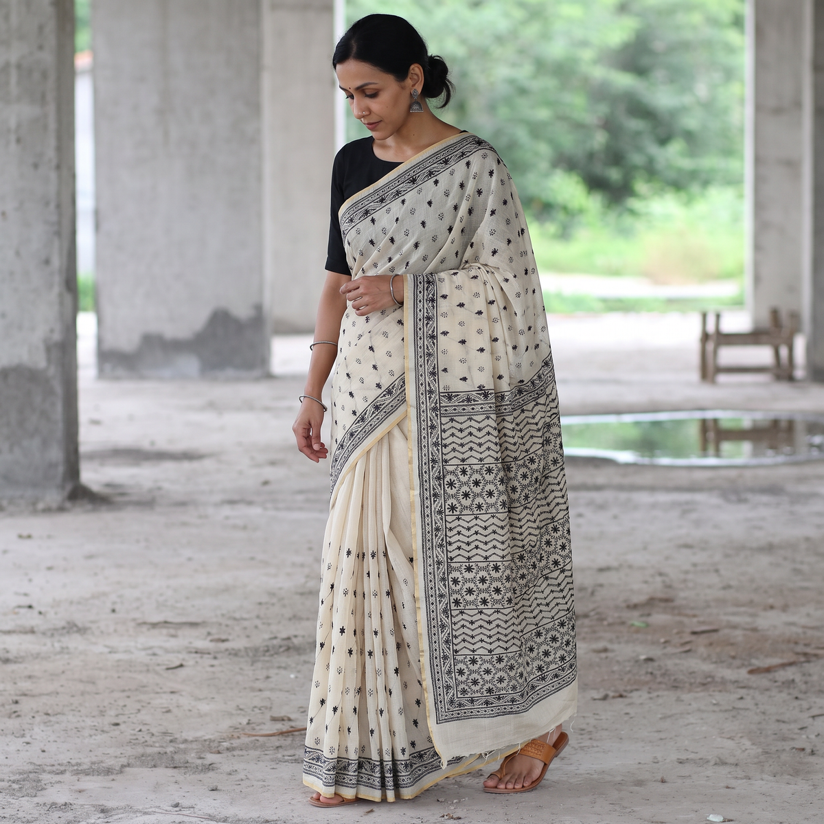 Cream Hand Embroidered Silk Cotton Chapa Work Saree, draped and worn by a woman, AI visual of the saree, iTokri