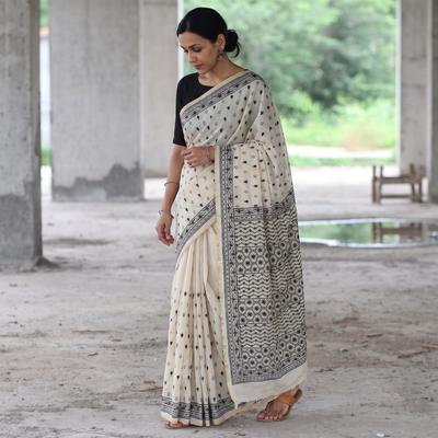Cream Hand Embroidered Silk Cotton Chapa Work Saree, draped and worn by a woman, AI visual of the saree, iTokri