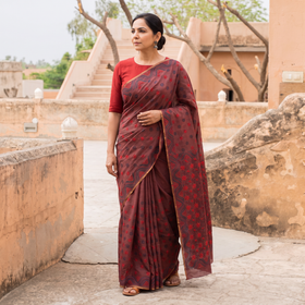 Brown Hand Embroidered Silk Cotton Chapa Work Saree, draped and worn by a woman, AI visual of the saree, iTokri