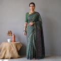 Green Hand Embroidered Silk Cotton Chapa Work Saree, draped and worn by a woman, AI visual of the saree, iTokri