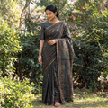 Black Hand Embroidered Silk Cotton Chapa Work Saree, draped and worn by a woman, AI visual of the saree, iTokri