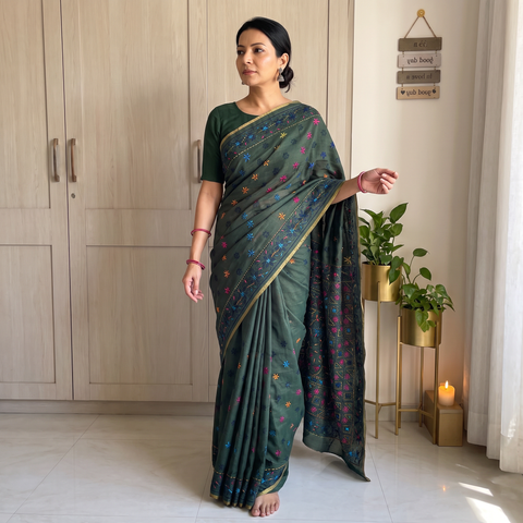 Green Hand Embroidered Silk Cotton Chapa Work Saree, draped and worn by a woman, AI visual of the saree, iTokri