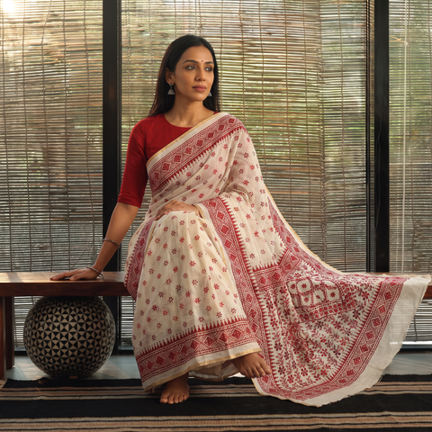 White Hand Embroidered Silk Cotton Chapa Work Saree, draped and worn by a woman, AI visual of the saree, iTokri