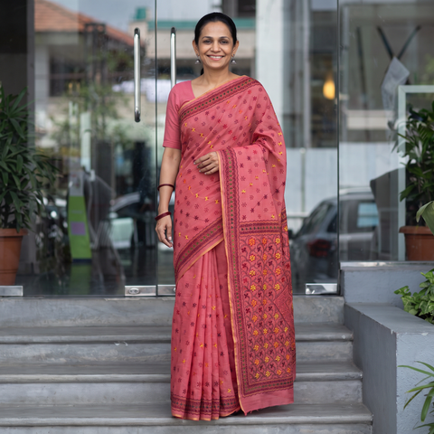 Pink Hand Embroidered Silk Cotton Chapa Work Saree, draped and worn by a woman, AI visual of the saree, iTokri