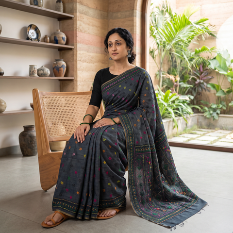 Black Hand Embroidered Silk Cotton Chapa Work Saree, draped and worn by a woman, AI visual of the saree, iTokri