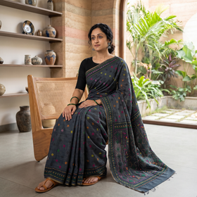 Black Hand Embroidered Silk Cotton Chapa Work Saree, draped and worn by a woman, AI visual of the saree, iTokri
