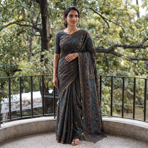 Black Hand Embroidered Silk Cotton Chapa Work Saree, draped and worn by a woman, AI visual of the saree, iTokri
