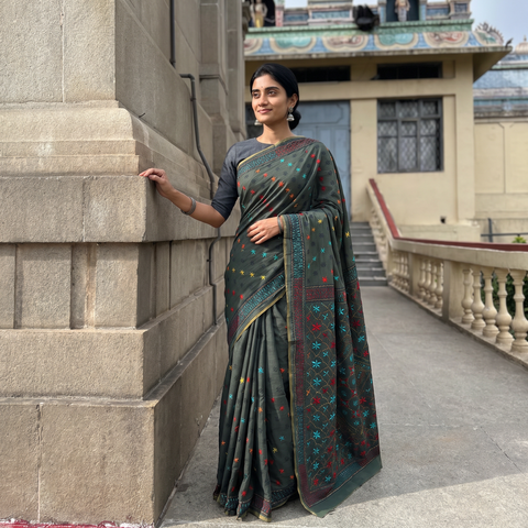 Green Hand Embroidered Silk Cotton Chapa Work Saree, draped and worn by a woman, AI visual of the saree, iTokri