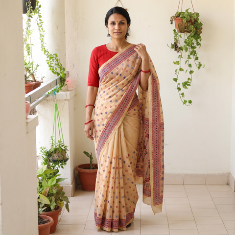 Beige Hand Embroidered Silk Cotton Chapa Work Saree, draped and worn by a woman, AI visual of the saree, iTokri