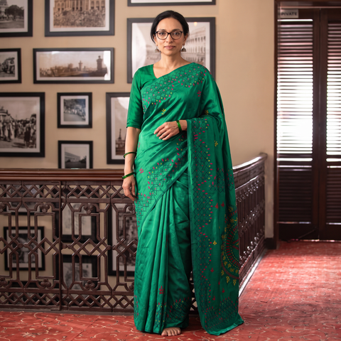 Green Hand Embroidered Silk Saree, draped and worn by a woman, AI visual of the saree, iTokri