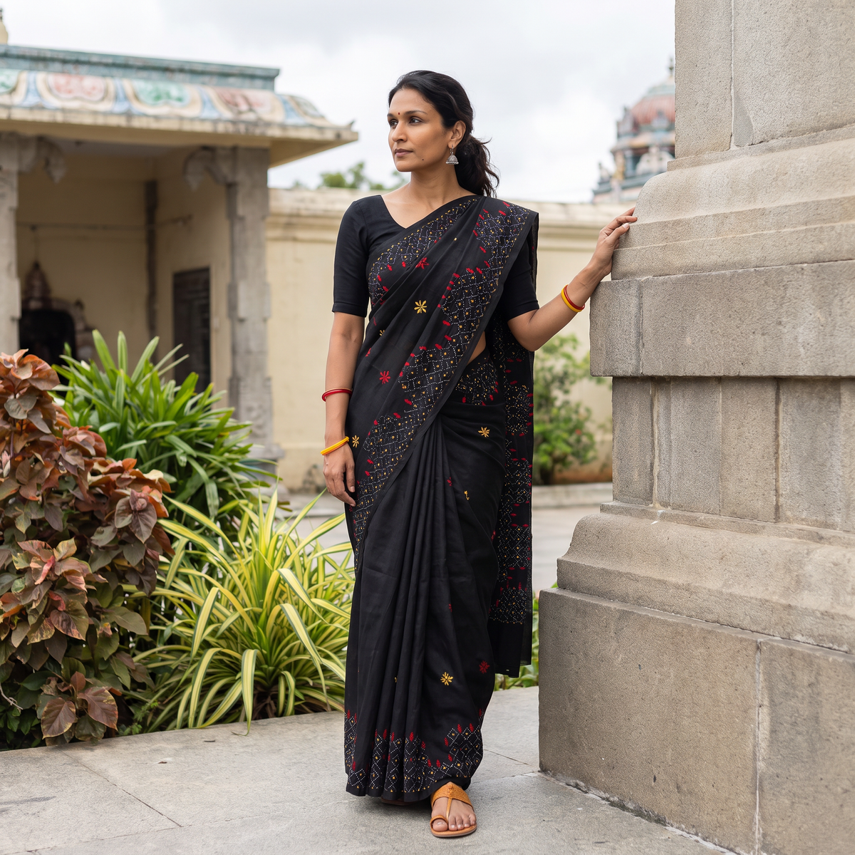 Black Hand Embroidered Silk Saree, draped and worn by a woman, AI visual of the saree, iTokri