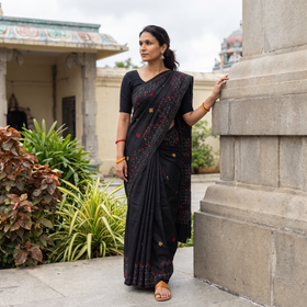 Black Hand Embroidered Silk Saree, draped and worn by a woman, AI visual of the saree, iTokri