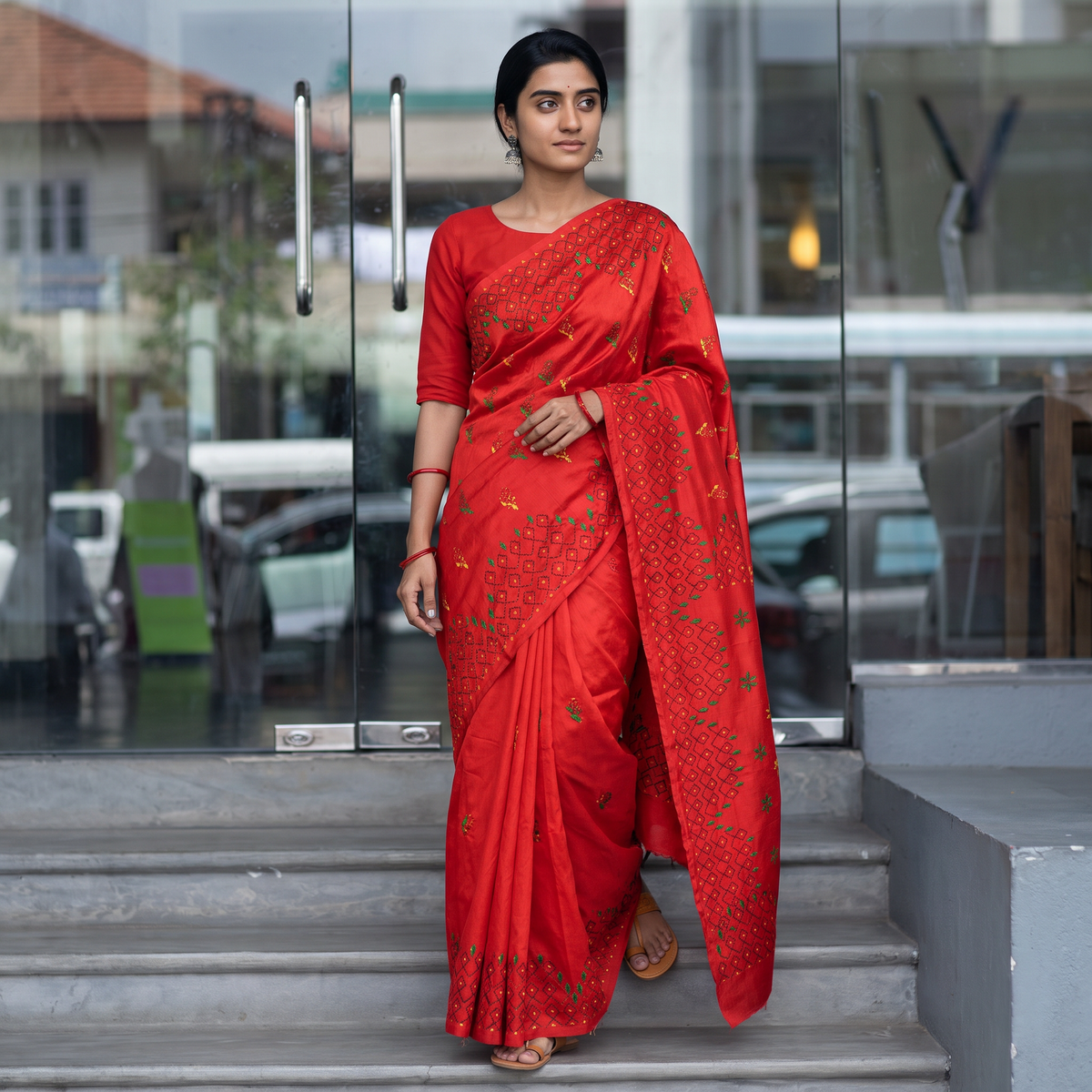 Red Hand Embroidered Silk Saree, draped and worn by a woman, AI visual of the saree, iTokri