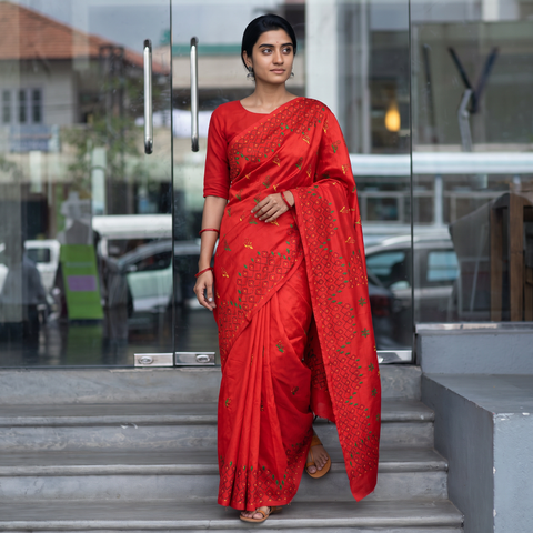 Red Hand Embroidered Silk Saree, draped and worn by a woman, AI visual of the saree, iTokri